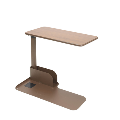 The Drive Couch & Lift Chair Swivel Table features a height-adjustable, rectangular wooden top in brown with a metal base and built-in item slot; its pivoting tabletop adds extra versatility.