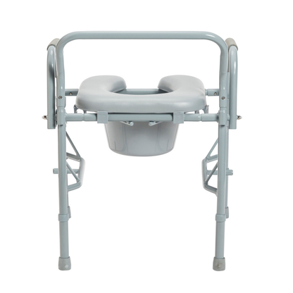 The Drive Drop Arm Steel Commode with Padded Seat is a portable gray chair with a raised padded seat, drop armrests, and removable bucket, designed for those with mobility issues needing comfort and easy transfers.