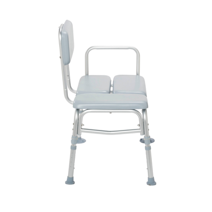 A side view of the Drive Medical Bariatric Padded Transfer Bench in light blue, featuring a padded backrest, two armrests, and adjustable legs with rubber tips for stability.