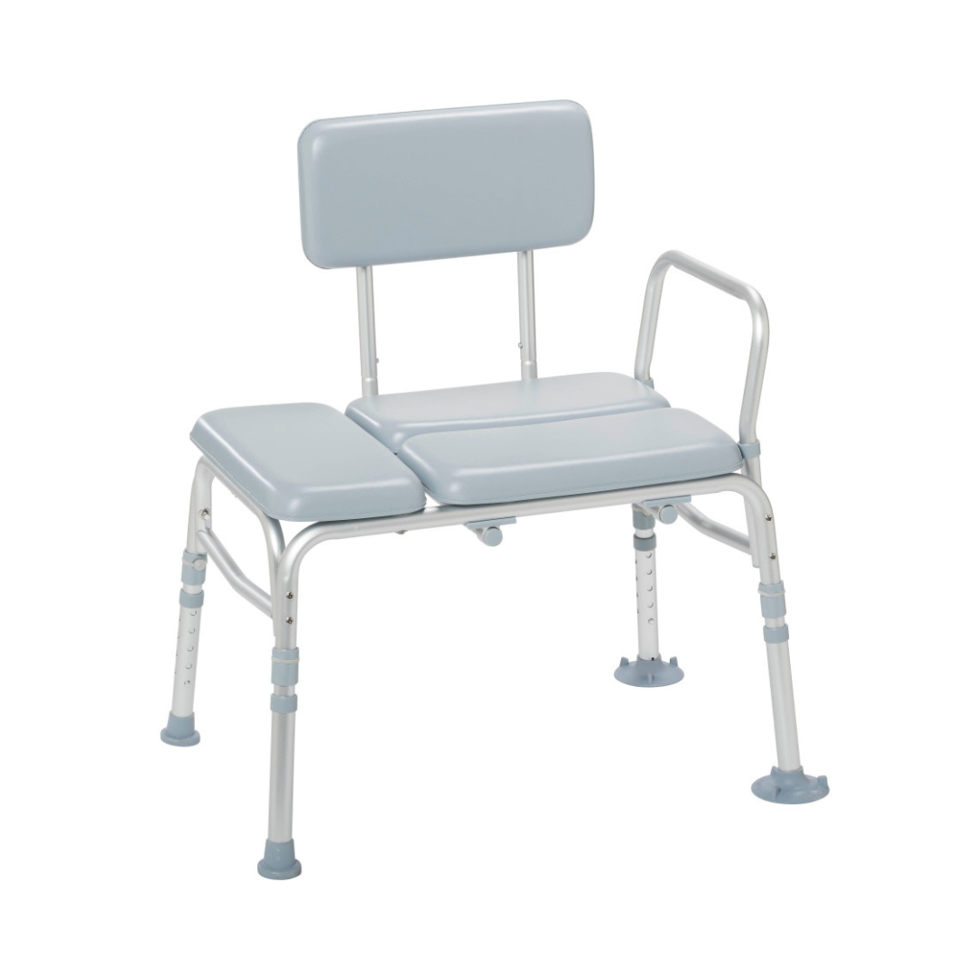 The Drive Medical Bariatric Padded Transfer Bench is a light blue and silver adjustable shower bench with a padded seat, backrest, and armrest, designed to assist individuals with limited mobility during bathing.
