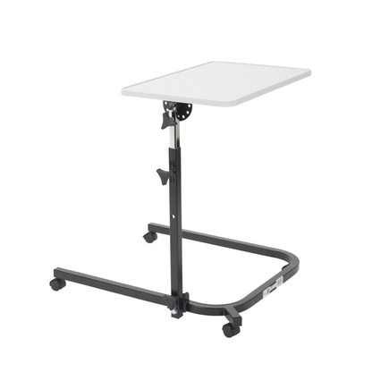 The Drive Pivot & Tilt Overbed Table features a white rectangular self-leveling tabletop and an adjustable black metal frame on wheels, ideal for hospitals or home care settings.