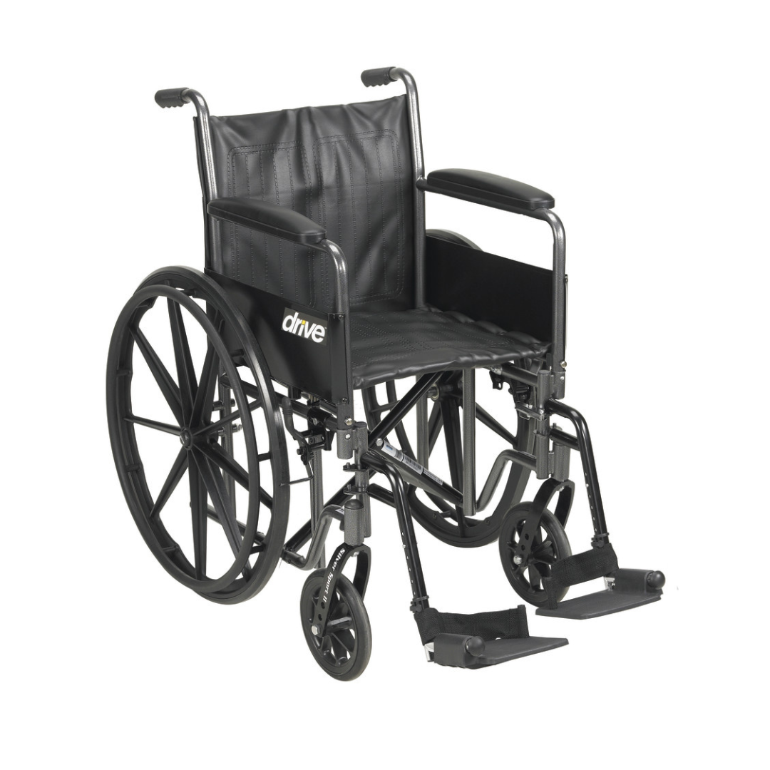The Drive Medical Silver Sport 2 Wheelchair features large rear wheels, small front wheels, footrests, armrests, and a black seat and backrest. The brand name "drive" appears on the side of this manual wheelchair.