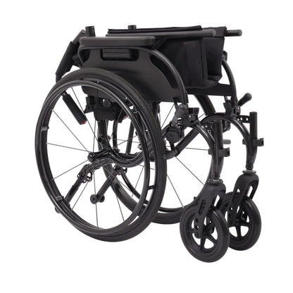 A Drive Nitro Cruise Wheelchairs | Ultralight & Portable folded for storage, with seat and footrests compacted. The visible wheels and frame highlight its streamlined 28 lbs wheelchair design.