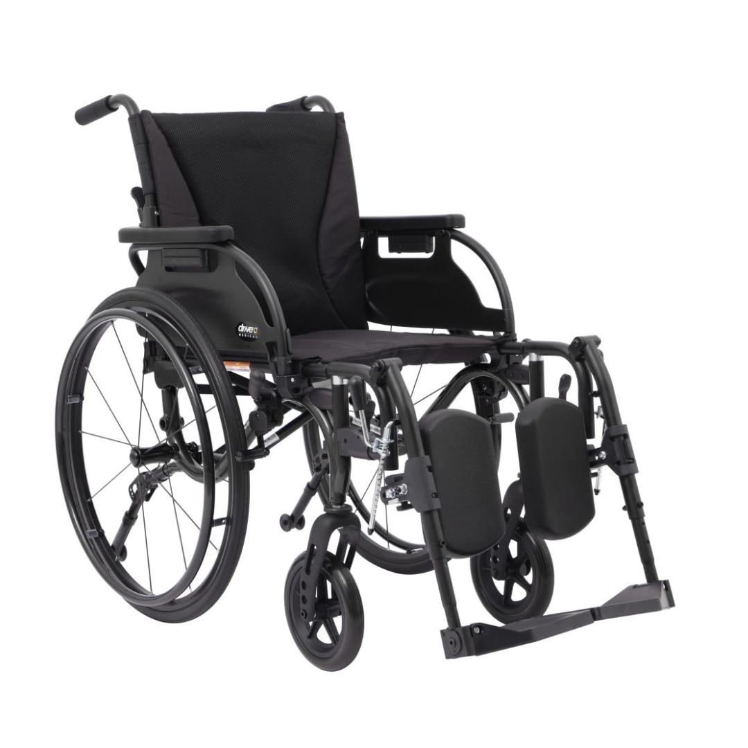 A black Drive Nitro Cruise Wheelchairs | Ultralight & Portable with large rear wheels, cushioned seat/backrest, padded adjustable leg supports, footrests, armrests, and a lightweight 28 lbs aluminum frame.