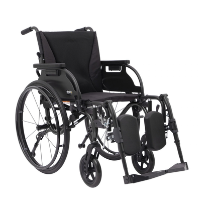 A black Drive Nitro Cruise Wheelchairs | Ultralight & Portable with large rear wheels, cushioned seat/backrest, padded adjustable leg supports, footrests, armrests, and a lightweight 28 lbs aluminum frame.