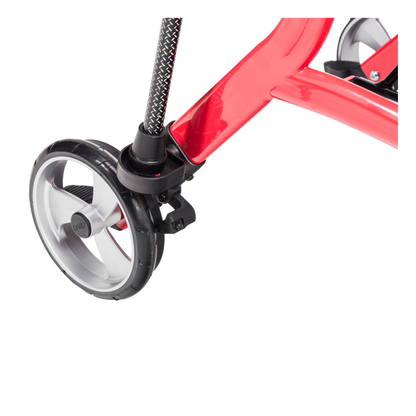 Close-up of a red tricycle’s rear wheel with a silver rim and black tire, resembling the design details found on the Cane Holder for Drive Nitro Sprint Rollators.