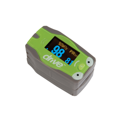 The Drive Pediatric Fingertip Pulse Oximeter, with green and gray casing, displays a blood oxygen saturation of 98% and a pulse rate of 81 bpm on its screen.
