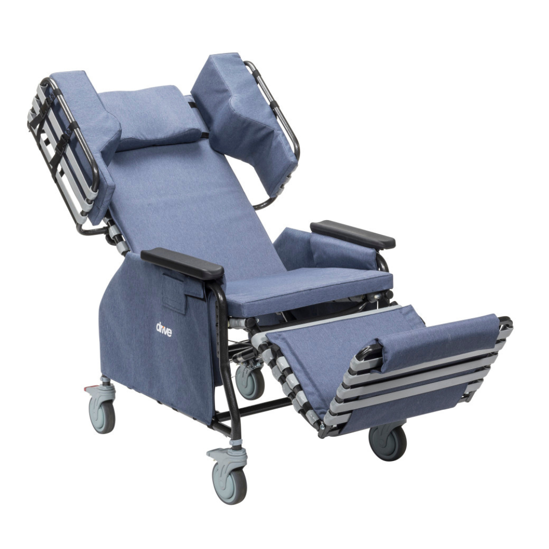 The Drive Rose Comfort Max Tilt and Recline Chair with Casters features padded cushions, adjustable headrest, footrest, armrests, four wheels, and a 400 lb capacity—ideal for patient comfort and mobility in long-term care settings.