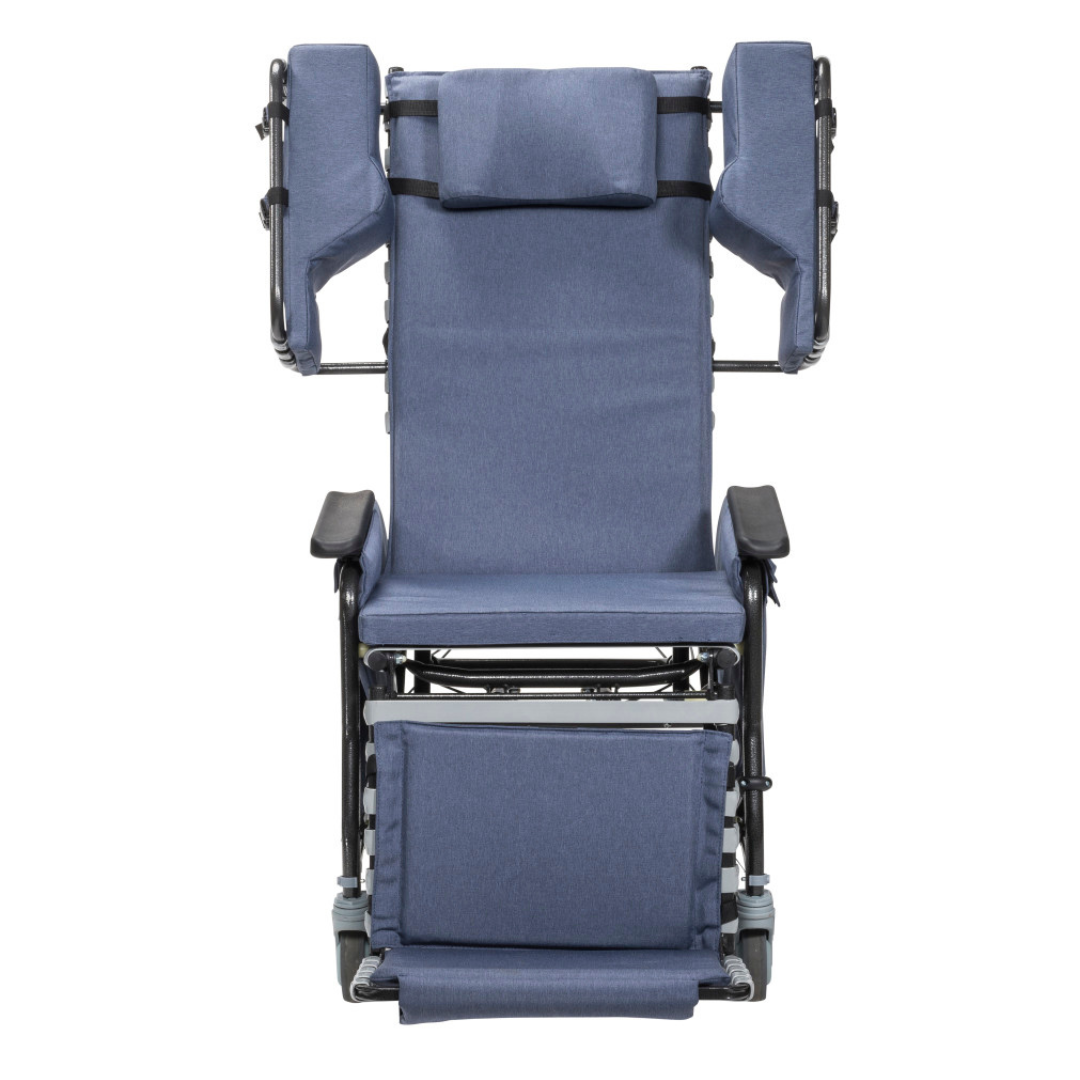 The Drive Rose Comfort Max Tilt and Recline Chair with Casters is a blue padded wheelchair with side supports, headrest, armrests, and elevated footrest; front view shown. Ideal for long-term care; supports up to 400 lbs.