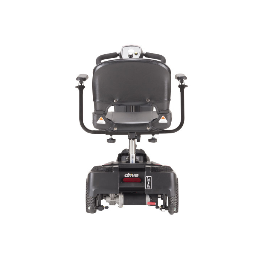 Rear view of a black Drive Scout Compact 3-Wheel Scooter featuring armrests, a padded seat, and three wheels, designed to assist those with mobility challenges by offering comfort and reliable support in a compact design.