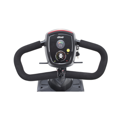 Close-up of the control panel and handlebars on the Drive Scout Compact 3-Wheel Scooter, showing buttons, a speed dial, and a key slot on a black console labeled "drive.