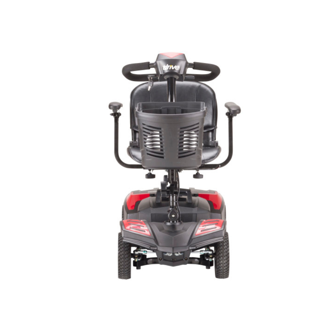 Front view of the Drive Scout Compact 3-Wheel Scooter featuring a black seat, armrests, a front basket on the handlebars, and red accents on the base.