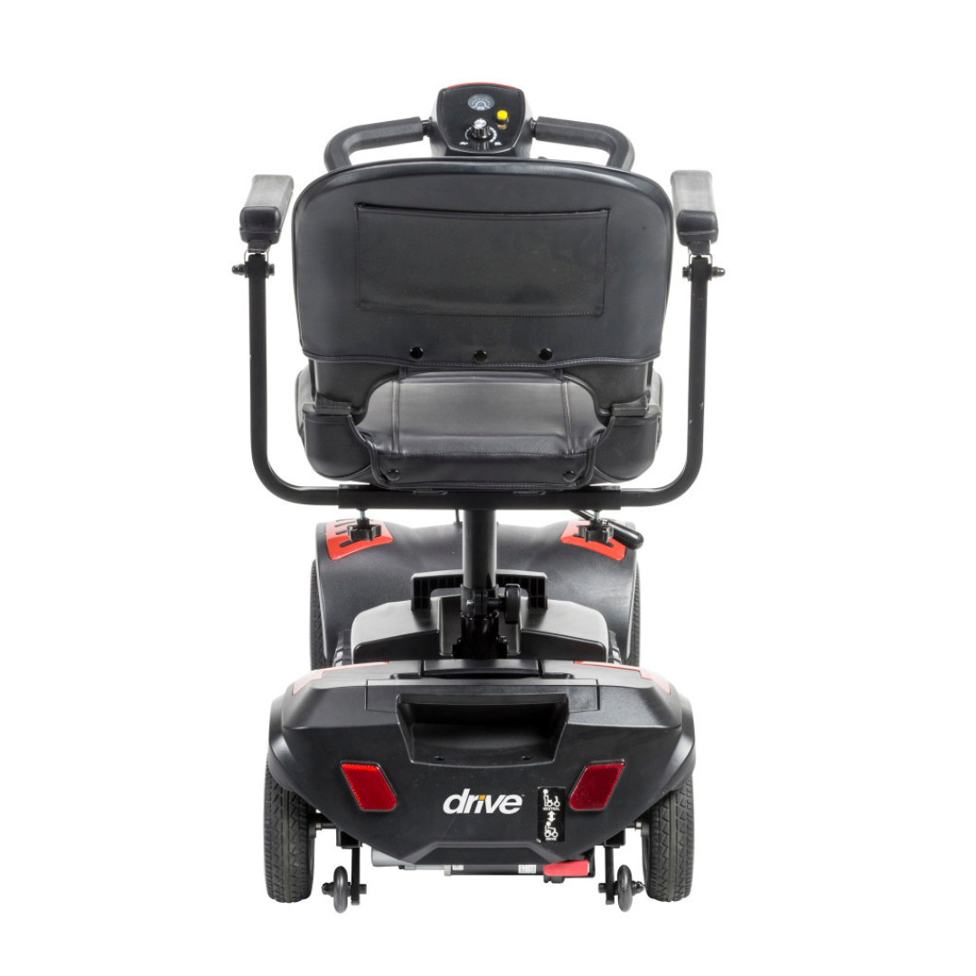 Rear view of a black Drive Scout LT 4-Wheel Scooter featuring armrests, a padded seat, and a control panel on the backrest. The scooter has two rear wheels and "Drive" branding visible on the lower back for easy identification.