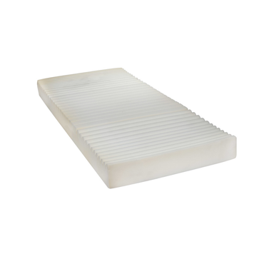 A rectangular white foam mattress with horizontal grooves, designed for the Drive Delta® Ultra-Light 1000 Bariatric Full-Electric Low Bed, displayed on a plain white background.