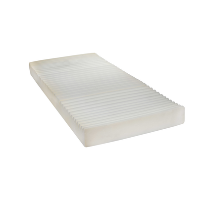 A rectangular white foam mattress with horizontal grooves, designed for the Drive Delta® Ultra-Light 1000 Bariatric Full-Electric Low Bed, displayed on a plain white background.