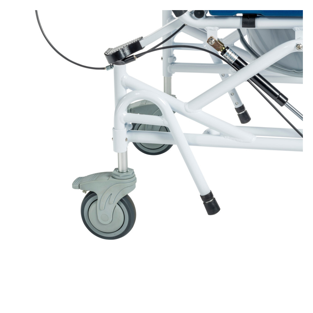 Close-up of the Drive Tilting Aluminum Rehab Rolling Shower Chair with Commode shows its white metal frame, gray and green caster wheel, structural bars, and hydraulic parts.