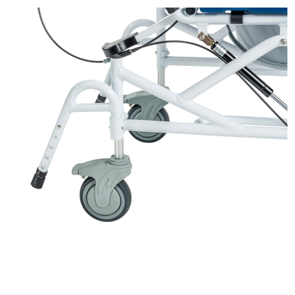 Close-up view of the lower part of the Drive Tilting Aluminum Rehab Rolling Shower Chair with Commode, showing two gray caster wheels attached to its white metal frame.