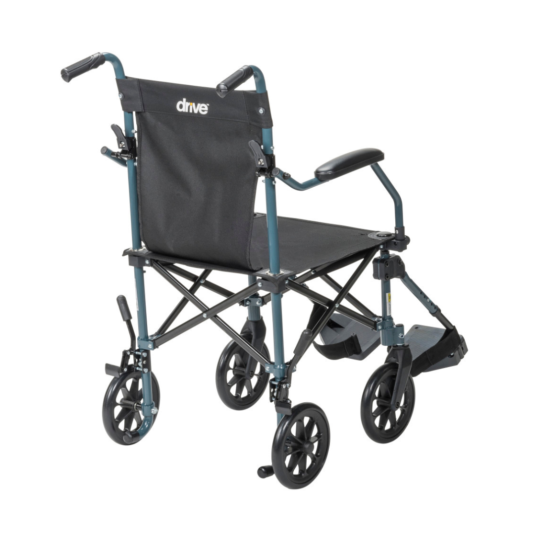 The Drive Travelite Transport Chair is ultra compact, features four small wheels, a black fabric seat and backrest, push handles, and comes with a rolling travel bag—perfect for travel and easy storage.