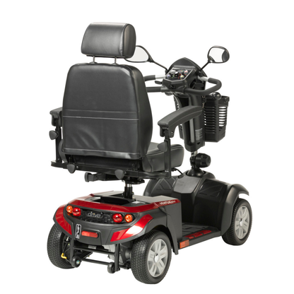 A Drive Ventura 4-Wheel HD Bariatric Scooter with a padded black seat, armrests, and headrest is shown from the rear, featuring rear lights, a storage basket, and a red and black color scheme.