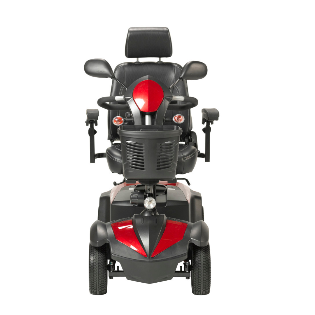 Front view of a black and red Drive Ventura 4-Wheel HD Bariatric Scooter featuring a padded seat, armrests, headrest, handlebars, and a front-mounted storage basket.