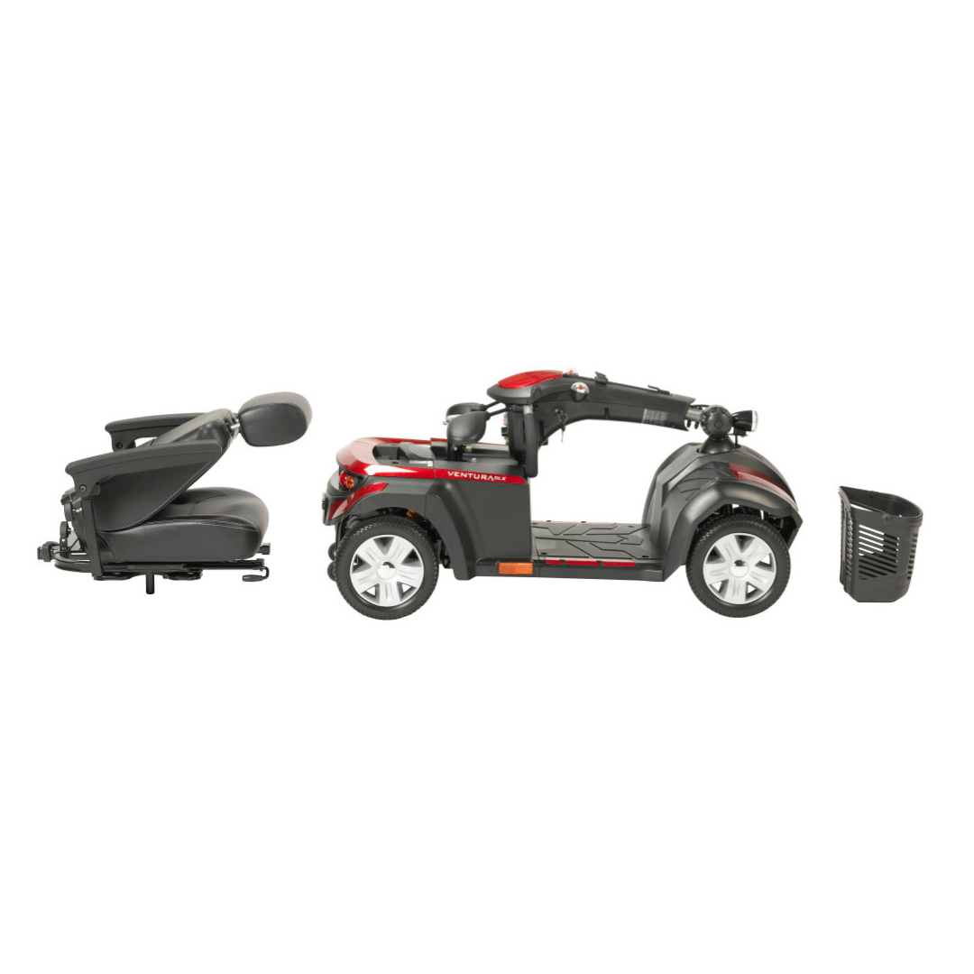 A Drive Ventura 4-Wheel HD Bariatric Scooter is shown disassembled: the padded seat with armrests, main scooter body, and removable front basket are lined up on a white background.