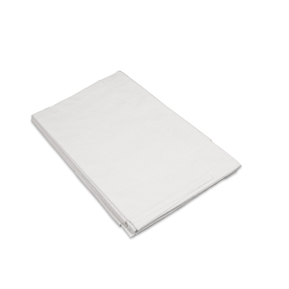 A stack of folded Dynarex Exam Room Drape Sheets is arranged on a white surface and viewed from an angle.