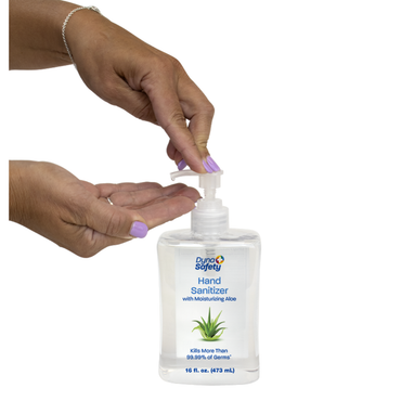 A person with lavender-painted nails dispenses moisturizing hand sanitizer from a clear pump bottle labeled Dynarex Hand Sanitizer with Moisturizing Aloe.