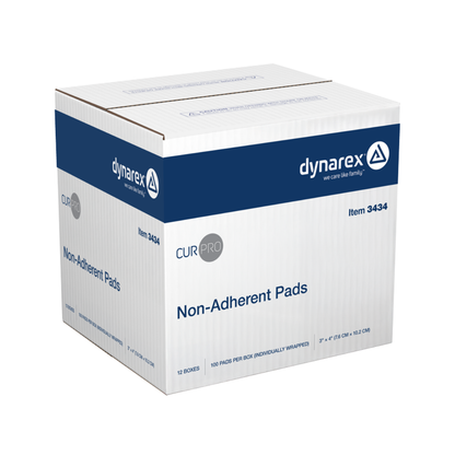 A white and blue box labeled Dynarex Non-Adherent Dressing Pads - Sterile contains 12 smaller boxes, each with 100 individually wrapped 2 x 3 in. pads that protect wounds effectively without sticking to injuries.