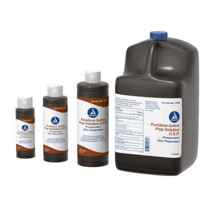 Four brown plastic bottles of Dynarex Povidone Iodine Prep Solutions in various sizes include a 1-gallon jug and smaller cylindrical bottles with white caps and orange-and-white labels for skin cleansing use.