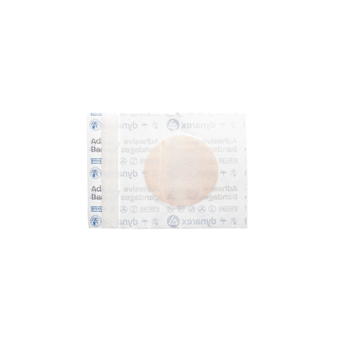 A sterile Dynarex Sheer Plastic Adhesive Bandage in unopened white packaging, featuring a visible circular pad and blue Dynarex branding along the left edge.