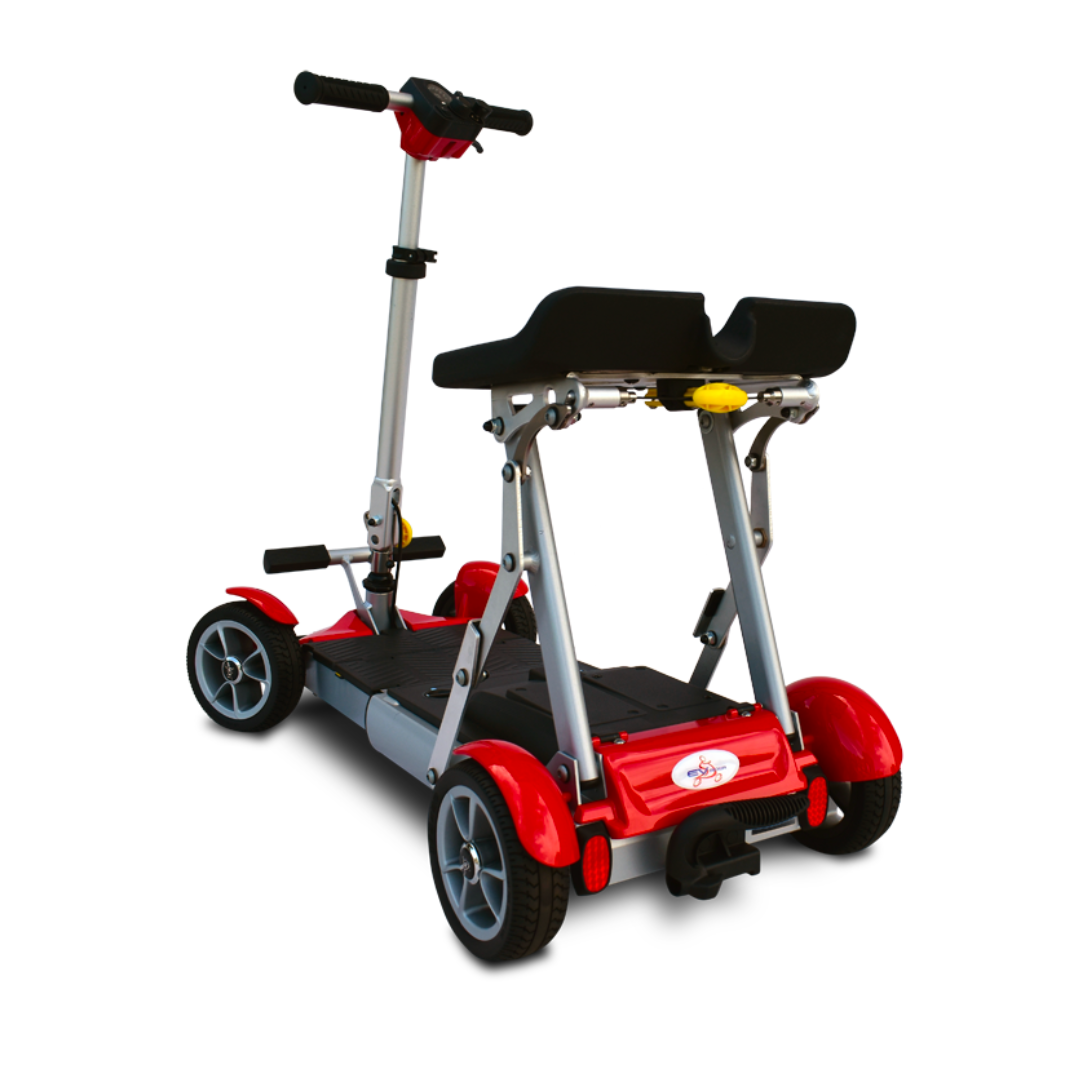 The EV Rider Gypsy Ultra Compact Airline Approved Scooter, shown in red and black with four sturdy wheels, upright handlebars, and a foldable seat, is pictured from the rear at an angle on a white background.