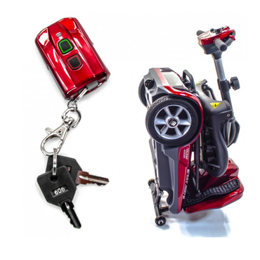 The EV Rider TranSport S19AF Automatic Folding Travel Scooter in compact red is shown folded upright next to its remote control and two keys attached to a keychain.