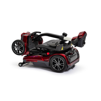 The EV Rider Transport 4M Travel Scooter is a compact, shiny red lightweight scooter with black wheels, silver hubcaps, and a seat that folds neatly within the frame for easy storage or transport.