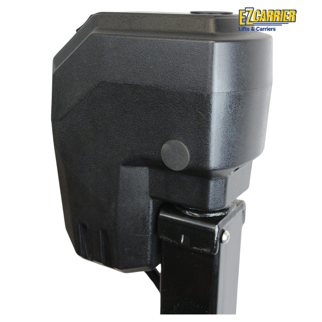 Close-up of a black, box-shaped EZ-Carrier Electric Lift – Manual Fold Up (Semi-Auto) motor attached to a metal post, with the EZ Carrier Lifts & Carriers logo top right. Visit our site for specs and downloads.
