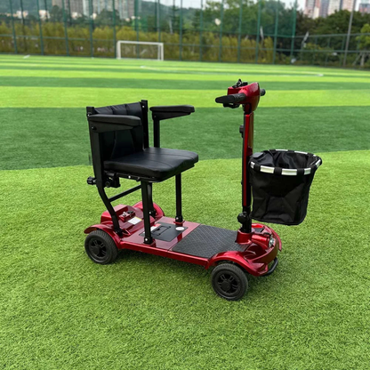An Easwe™ M10 Portable Long Range Mobility Scooter in red with a black seat, armrests, and front basket is parked on green turf near a soccer goal and trees. The scooter offers a 30-mile range for extended outings.