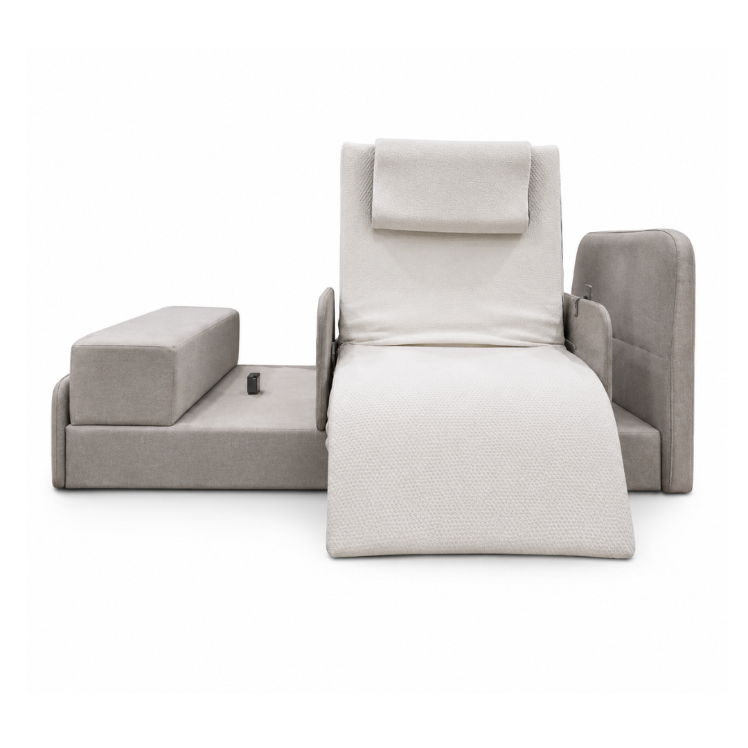The Elevra Deluxe Rotating Lift Assist Bed, shown against a white background, offers advanced homecare comfort with a modern beige design, adjustable backrest, attached armrests, and separate rectangular cushions on each side.