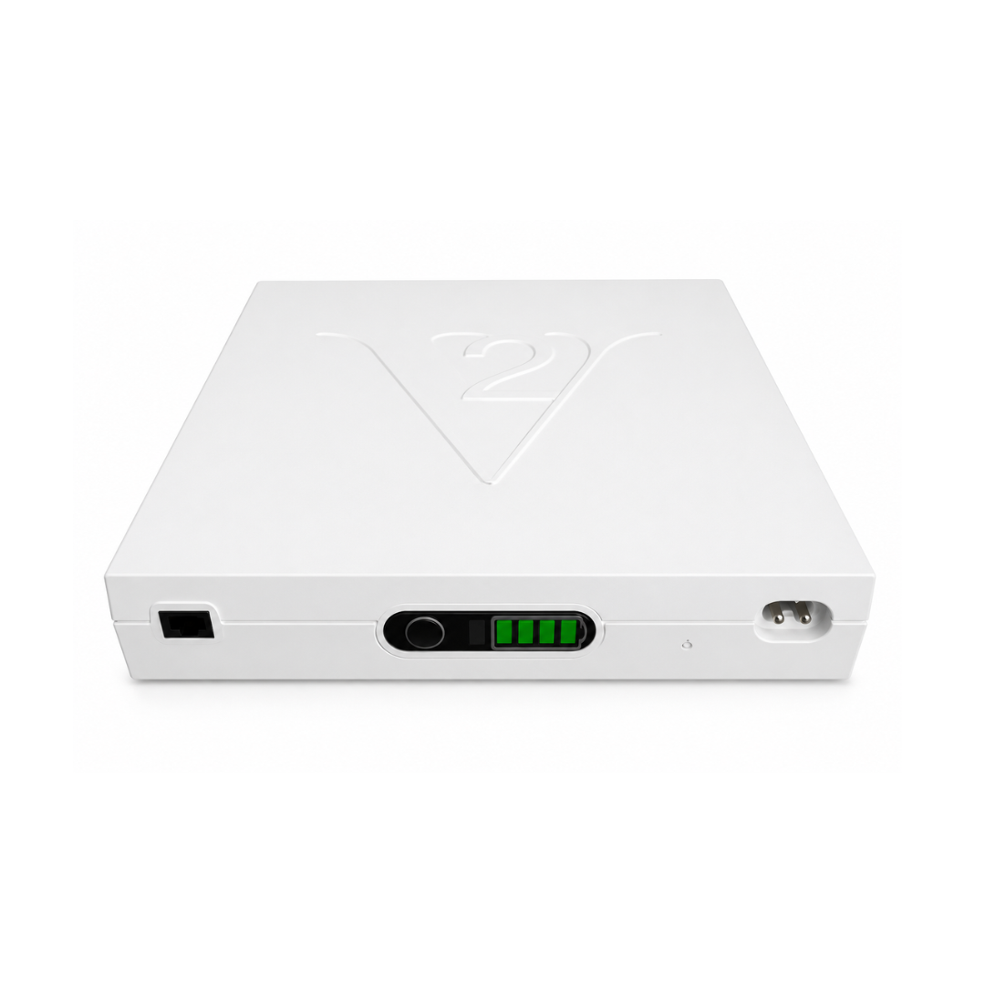 The Vault - Universal Rechargeable Battery Backup by Enouvation is a white device with a raised V2 logo, power button, indicator lights, and connector ports on the front panel, offering reliable backup power for your electronics.