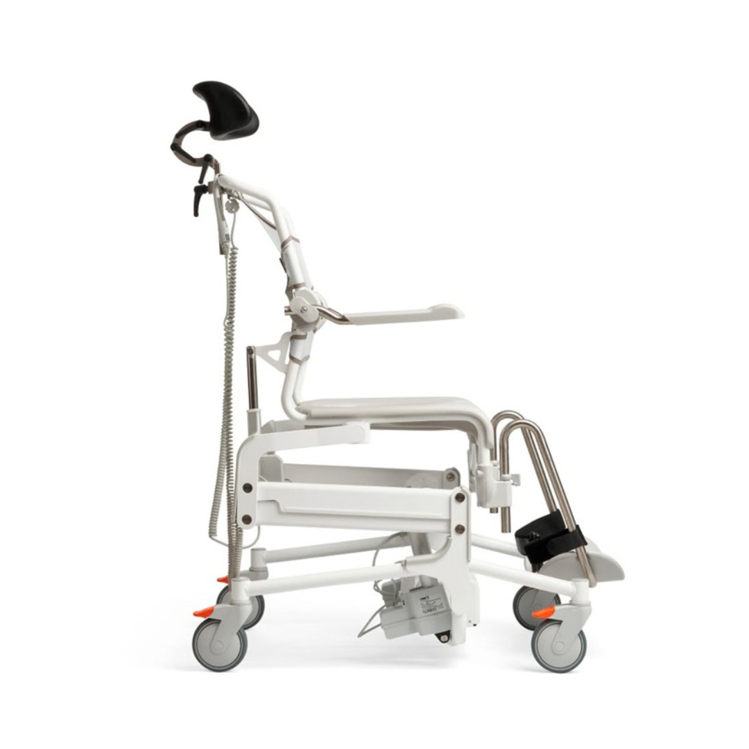 Side view of an Etac Alto Electrically Powered Shower Commode Chair, featuring a white frame with a black headrest, armrests, and footrests on locking casters.
