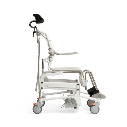 Side view of an Etac Alto Electrically Powered Shower Commode Chair, featuring a white frame with a black headrest, armrests, and footrests on locking casters.