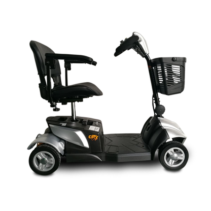 The EV Rider CityCruzer Portable Scooter is shown in black and silver with a front basket, padded seat with armrests, and handlebar controls, displayed from the side on a white background.