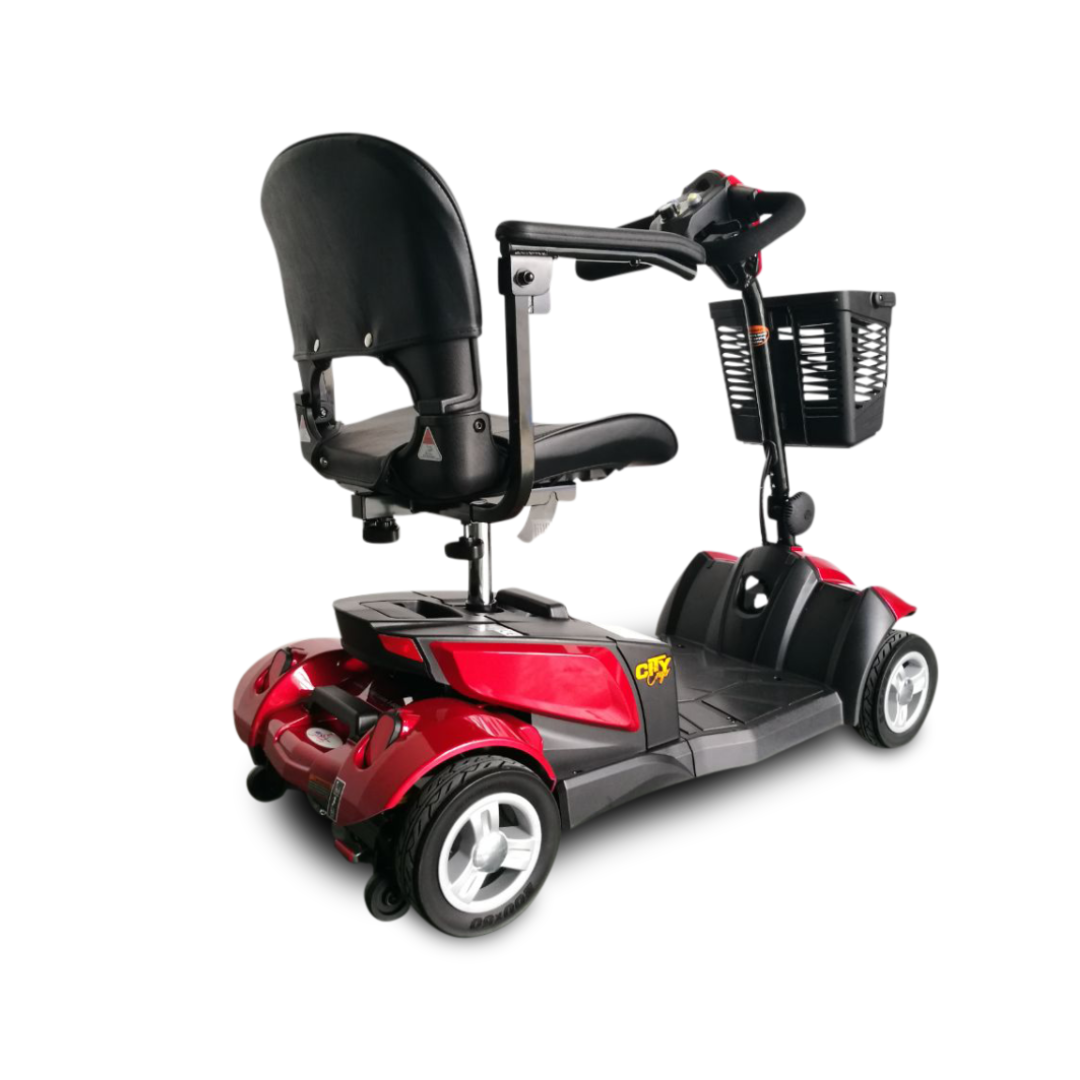 A red and black EV Rider CityCruzer Portable Scooter with a black seat, armrests, and a front basket is shown from a rear angled view against a white background.