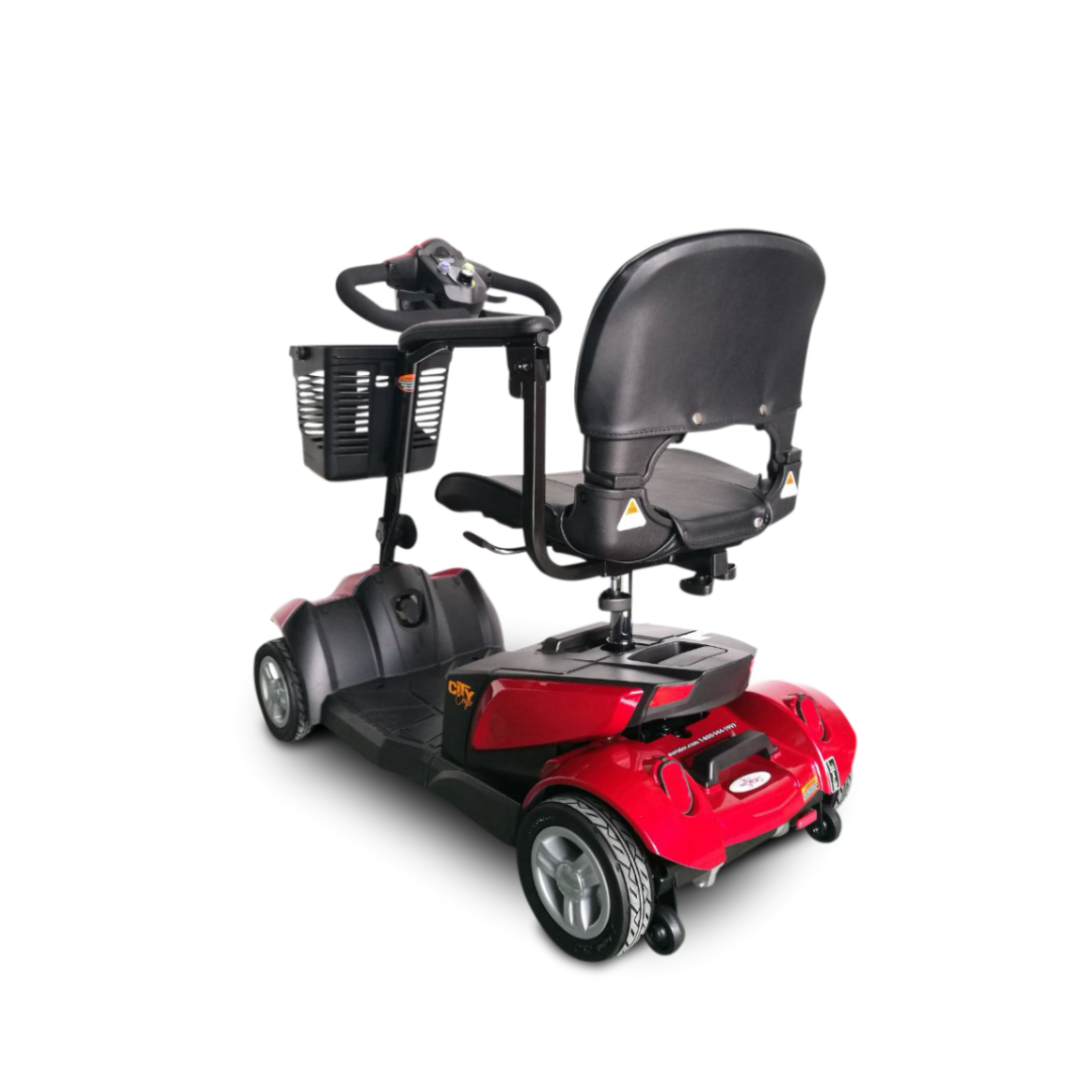 A red and black EV Rider CityCruzer Portable Scooter with a black cushioned seat, backrest, handlebars control panel, and front basket, shown from a rear-side angle on a white background.