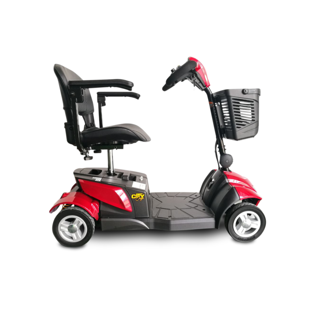 A red-and-black EV Rider CityCruzer Portable Scooter with a high-back seat, armrests, three wheels, and a black front basket is shown in profile against a white background.