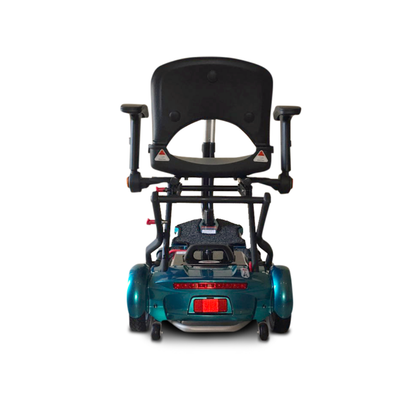 A teal EV Rider Transport Plus Portable Mobility Scooter viewed from the back displays its seat with armrests, rear wheels, and a small red reflector near the base against a plain white background.