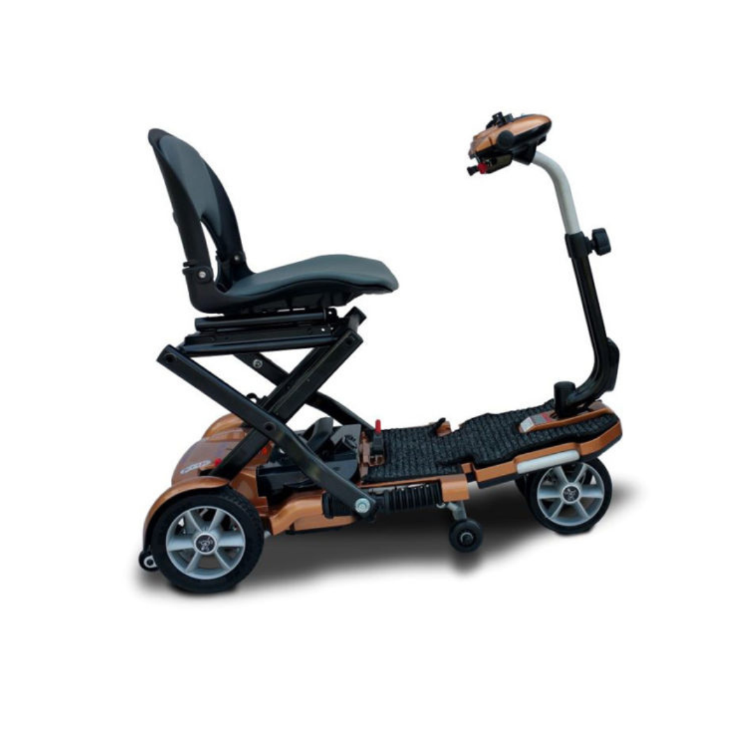 The EV Rider Transport Plus Portable Mobility Scooter features a compact, foldable design with four wheels, handlebars, and a raised seat—shown in profile on a white background—ideal for easy transport and portability.