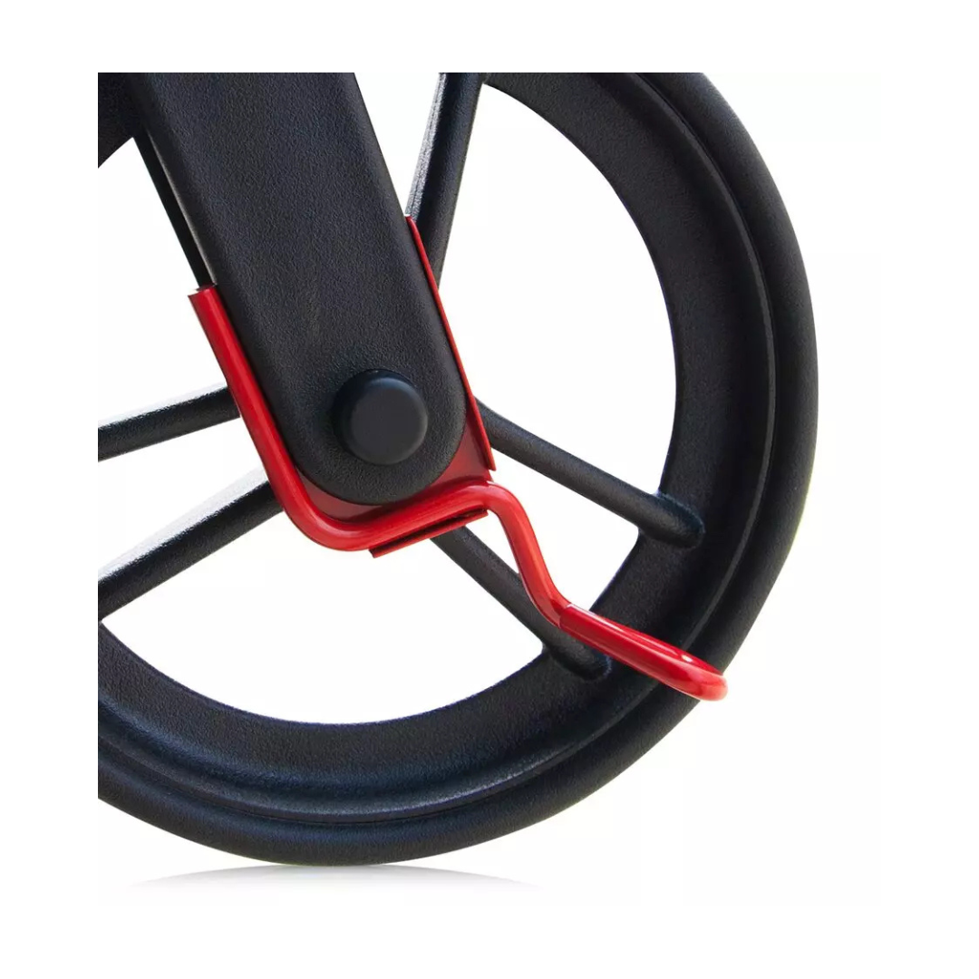 Close-up of Curb Climbers For Evolution Rollators—black wheel with red metal locking mechanism on frame—an essential accessory, shown isolated on a white background.