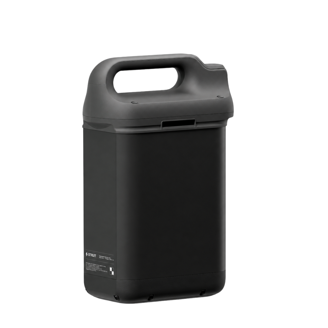 A black, rectangular Extra Batteries pack (Strutt ev1 compatible) with a convenient top handle is shown from an angle. The modern, utilitarian design features a small label on the lower side.