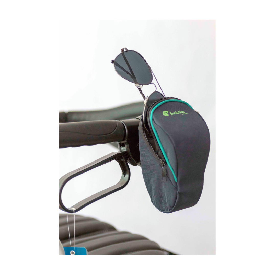 A compact black Eyeglass Holder For Evolution Rollators with a green zipper is attached to a bicycle handlebar, featuring sunglasses hanging from the zipper.