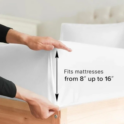 Hands pulling the white fitted sheet from the Ez Elite Comfort Twin / Twin XL Size Sheet Set over a mattress corner with an arrow graphic indicating it fits mattresses from 8 to 16 inches deep.