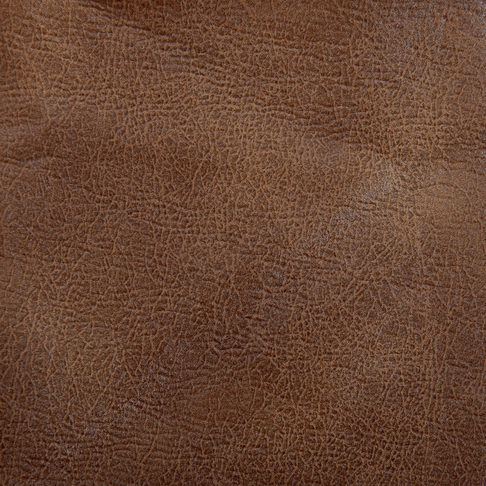 A textured brown surface resembling leather features fine lines and creases, highlighted by light to create depth, much like the luxurious feel of the Golden Tech PR510 MaxiComfort Cloud Recliner With Lift Assist - Extra Wide embracing you in Zero Gravity+ (ZG+) positioning.